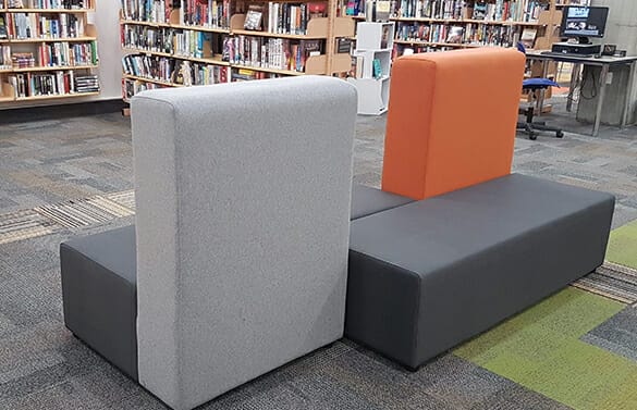 orange and grey modular soft seating in library