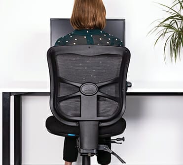 woman sitting with healthy posture on buro metro chair