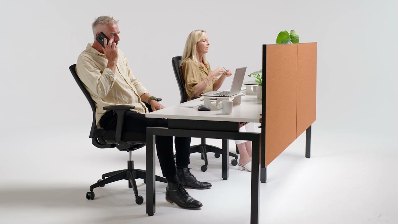 Buro Metro chair with aluminium base in a home office scene next to a bookshelf