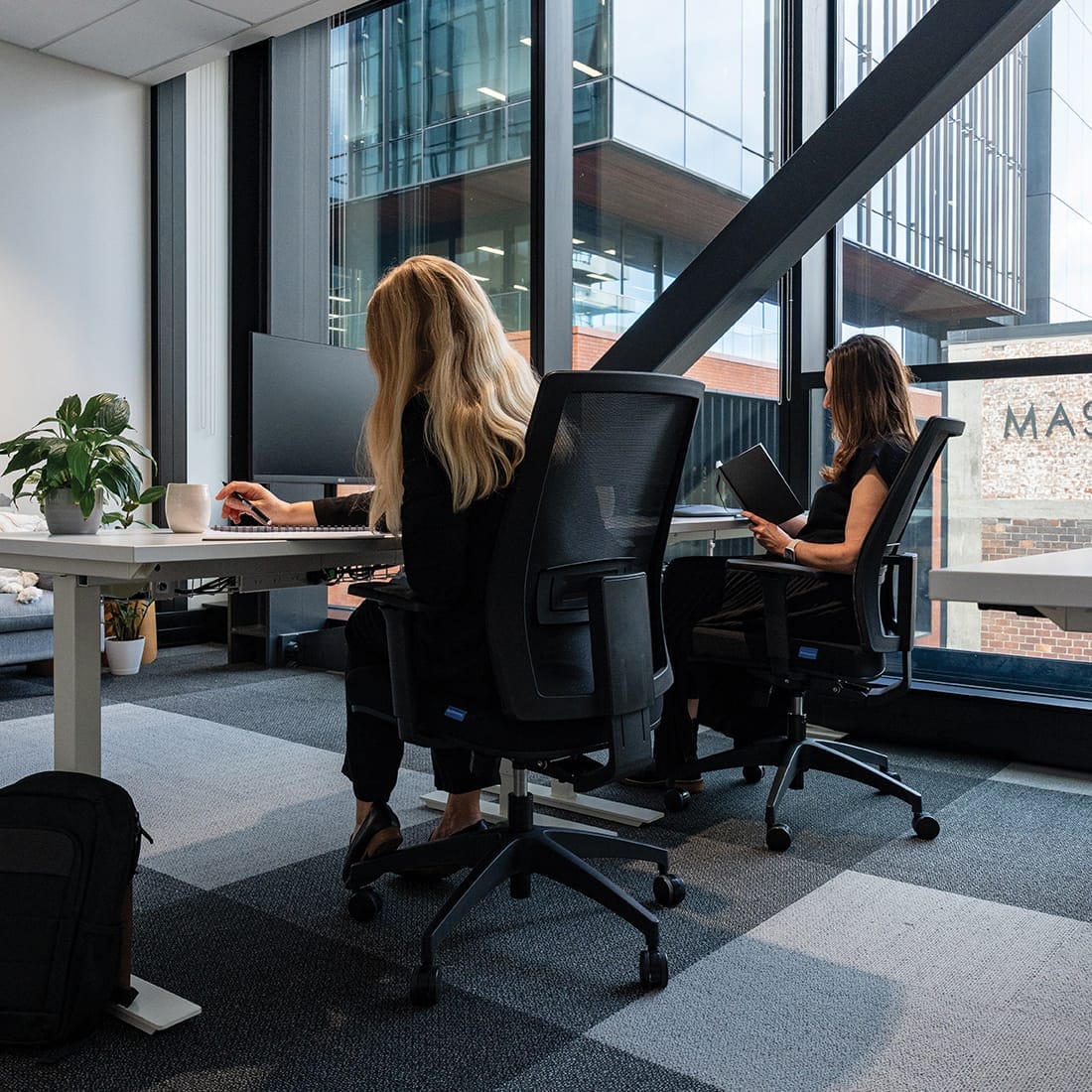 Buro Mantra working at desk in office